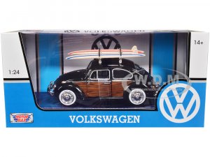 1966 Volkswagen Beetle Black with Wood Panels and Two Surfboards on Roof Rack